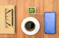 Top view image of coffee cup and cellphone on wooden table Royalty Free Stock Photo