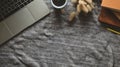 Top view image of Computer laptop, Old books, Coffee cup and Wild grass putting together on working table. Royalty Free Stock Photo