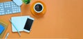 Top view image of cropped white smartphone with black empty screen putting on colorful working desk. Royalty Free Stock Photo