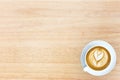 top view image of cup of latte art coffee over wooden textured t Royalty Free Stock Photo