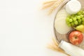 Top view image of dairy products and fruits over wooden background. Symbols of jewish holiday - Shavuot.