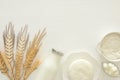 Top view image of dairy products over white wooden background. Symbols of jewish holiday - Shavuot.