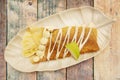 Top view image of delicious sweet crepe with white chocolate, chocolate syrup, Royalty Free Stock Photo