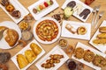 Top view image of desserts, pasta, sweets, breads, muffins, palm trees, juices and typical condiments of a patisserie