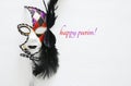 Top view image of dramatic masquerade venetian mask over white background. Flat lay. Purim celebration concept
