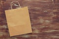 Top view image of empty recycle shopping bag on wooden background