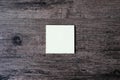 Top view image of empty sticky note paper on the wooden table.