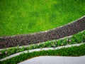 Top view image, fresh green Burmuda grass smooth lawn as a carpet with curve form of colorful flower and bush Royalty Free Stock Photo