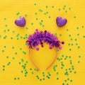 Top view image of funny party head glitter accessory with hearts. Flat lay. Purim celebration concept