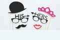 Top view image of funny photo booth props with text: HIS, HERS for party or wedding over white background. Royalty Free Stock Photo