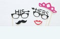 Top view image of funny photo booth props with text: HIS, HERS for party or wedding over white background. Royalty Free Stock Photo