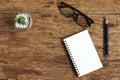 Top view image glasses of open notebook with pen on wooden table Royalty Free Stock Photo