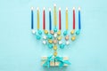 Top view image of jewish holiday Hanukkah background with traditional spinnig top, menorah