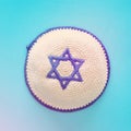 Top view image of jewish Kippah yarmulke hat with david star. holidays and shabbat concept.