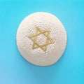 Top view image of jewish Kippah yarmulke hat with david star. holidays and shabbat concept.