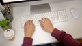 Top view image of an office man is working at his desk, typing on computer keyboard Royalty Free Stock Photo