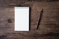 Top view image of open notebook with blank page and pen on the w Royalty Free Stock Photo