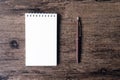 Top view image of open notebook with blank page and pen on the w Royalty Free Stock Photo