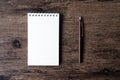 Top view image of open notebook with blank page and pen on the w Royalty Free Stock Photo