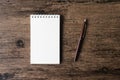 Top view image of open notebook with blank page and pen on the w Royalty Free Stock Photo