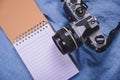 top view image of open notebook with blank pages and cactus and camera on wooden table Royalty Free Stock Photo