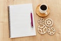 top view image of open notebook with blank pages next to cup of coffee on wooden table. ready for adding text or mockup. Royalty Free Stock Photo