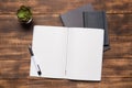 top view image of open notebook with blank pages next to cup of coffee on wooden table. ready for adding text Royalty Free Stock Photo