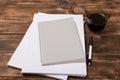 top view image of open notebook with blank pages next to cup of coffee on wooden table. ready for adding text Royalty Free Stock Photo