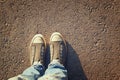 Top view image of person with shoes over asphalt road Royalty Free Stock Photo