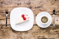 Top view image of piece of cheesecake with coffee.
