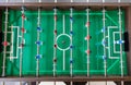 Top view image of plastic players in a table football game. Table football in the entertainment center Royalty Free Stock Photo