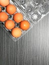 Top view image of raw chicken eggs in plastic tray with copy space. Royalty Free Stock Photo