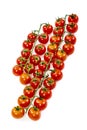 Top view image of several bunches of ripe cherry tomatoes with their green branches Royalty Free Stock Photo