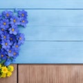 Top view image of sunflowers over blue wooden background. flowers over vintage painted blue wooden table. Backdrop with copy space Royalty Free Stock Photo