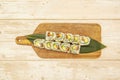 Top view image of uramaki california roll sushi with sesame seeds, nori seaweed, cream cheese, salmon and avocado Royalty Free Stock Photo