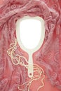 Top view image of vintage hand mirror and delicate female romantic scarf