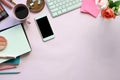 Top view image of woman accessories putting on the pink working desk. Royalty Free Stock Photo