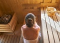 Top view image of woman relaxing in the wellness spa, sweating in Finnish sauna Royalty Free Stock Photo