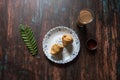 Top view of Indian snack samosa and tea along with condiments