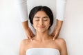 Top view of indian woman receiving relaxing shoulder massage Royalty Free Stock Photo