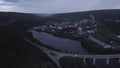 Top view of industrial city by river on summer evening. Clip. Beautiful landscape of industrial town by river among Royalty Free Stock Photo