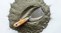 Top view of industrial working spatula tool and pile of cement dust, isolated on white Royalty Free Stock Photo