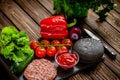 Top view of ingredients for beef black burger on a black stone board. Black burger Royalty Free Stock Photo