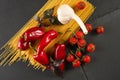 Top view of ingredients for traditional italian cuisine - dry pasta Royalty Free Stock Photo