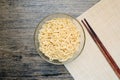 Top view of instant noodle in the glass bowl near the chopsticks Royalty Free Stock Photo