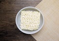 Top view of instant noodle in the glass bowl on the wooden table Royalty Free Stock Photo