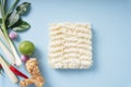 Top view - Instant noodle with Tom Yum ingredients over blue background
