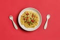 Top view of instant noodle in white bowl with plastic fork and s Royalty Free Stock Photo