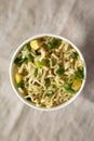 Top view, instant noodles with beef flavor in a paper cup. Overhead, from above, flat lay. Close-up