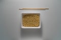 TOP VIEW: Instant noodles with chopsticks on a table